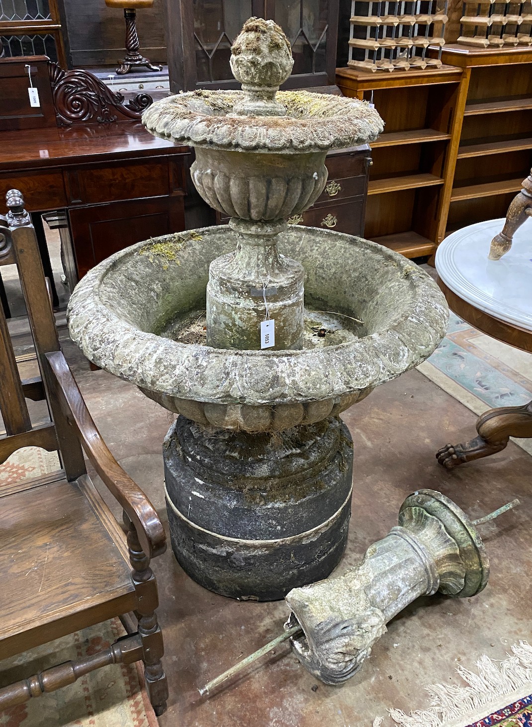 A large circular reconstituted stone garden fountain, diameter approx. 90cm. height 140cm, Provenance- the late Maureen Marchioness of Dufferin and Ava, Owl House Gardens, Lamberhurst, Kent